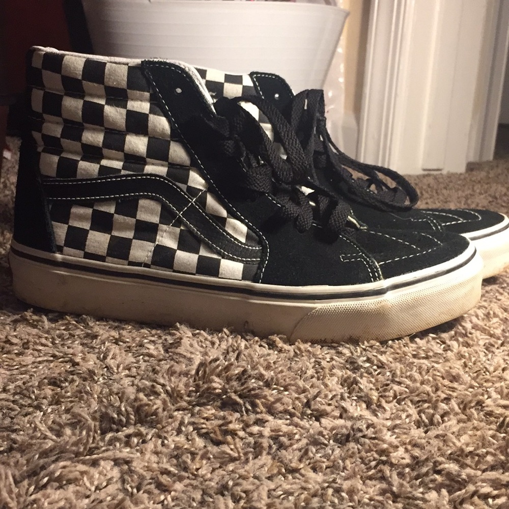 Black and white high top vans